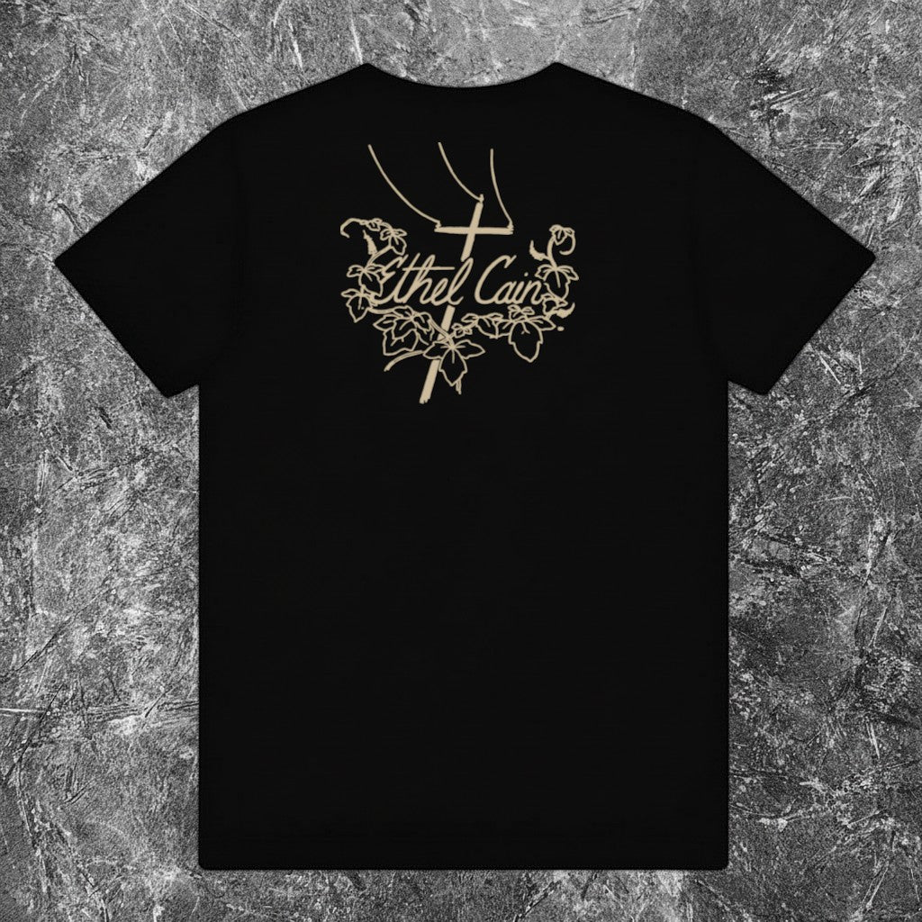 We Rock Ethel Cain black heavyweight cotton t-shirt featuring a beige graphic of a cross and ivy vines