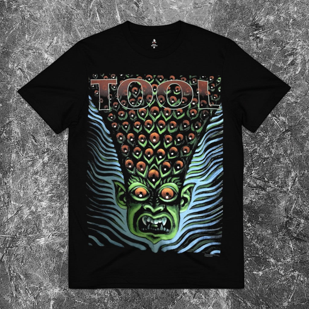 We Rock heavyweight black cotton t-shirt with a vintage-washed finish and relaxed fit on a textured grey background