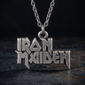 We Rock Iron Maiden logo pendant necklace in distressed silver metal on a dark textured background