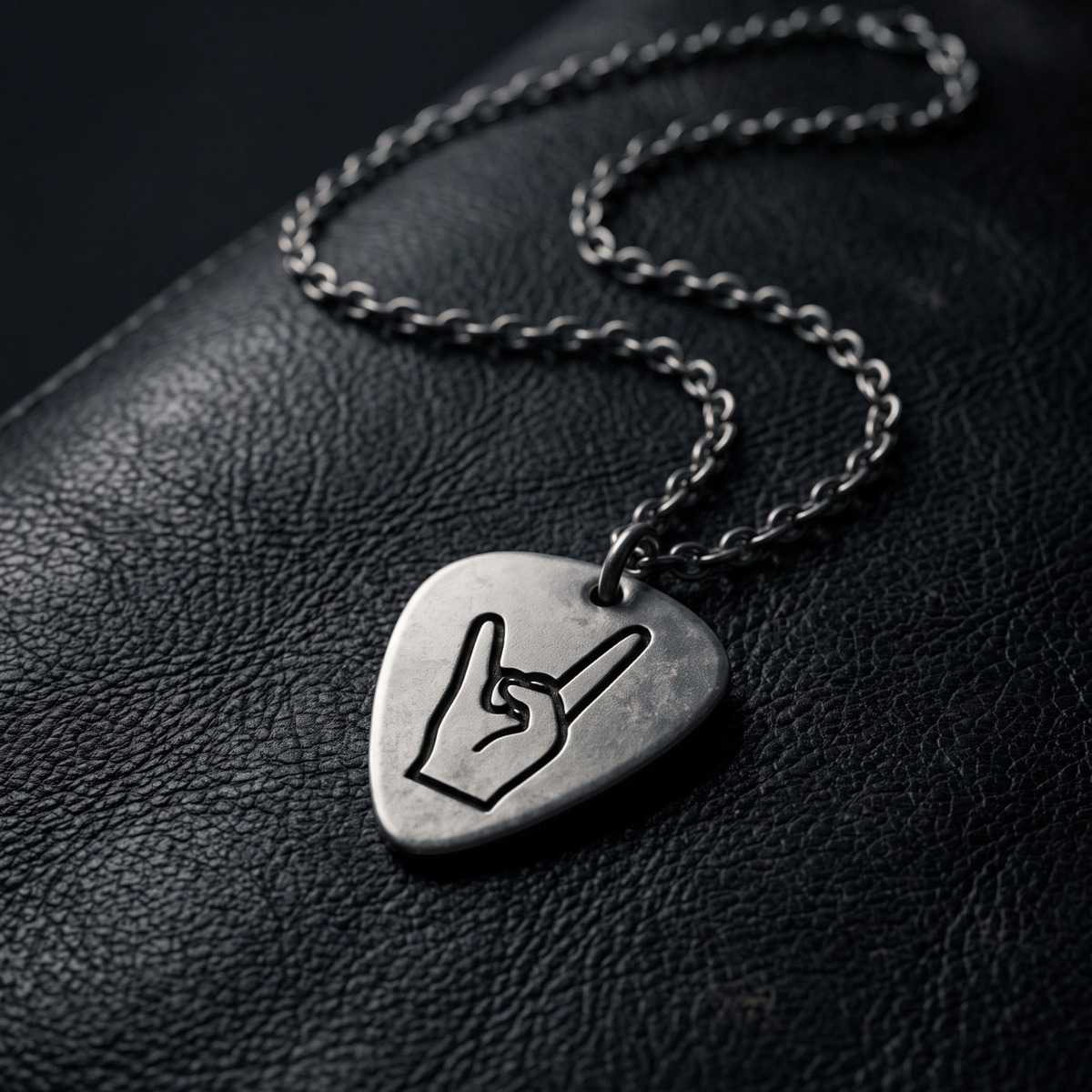 We Rock LED ZEPPELIN guitar pick necklace featuring a metal pick with a rock hand sign on a silver chain