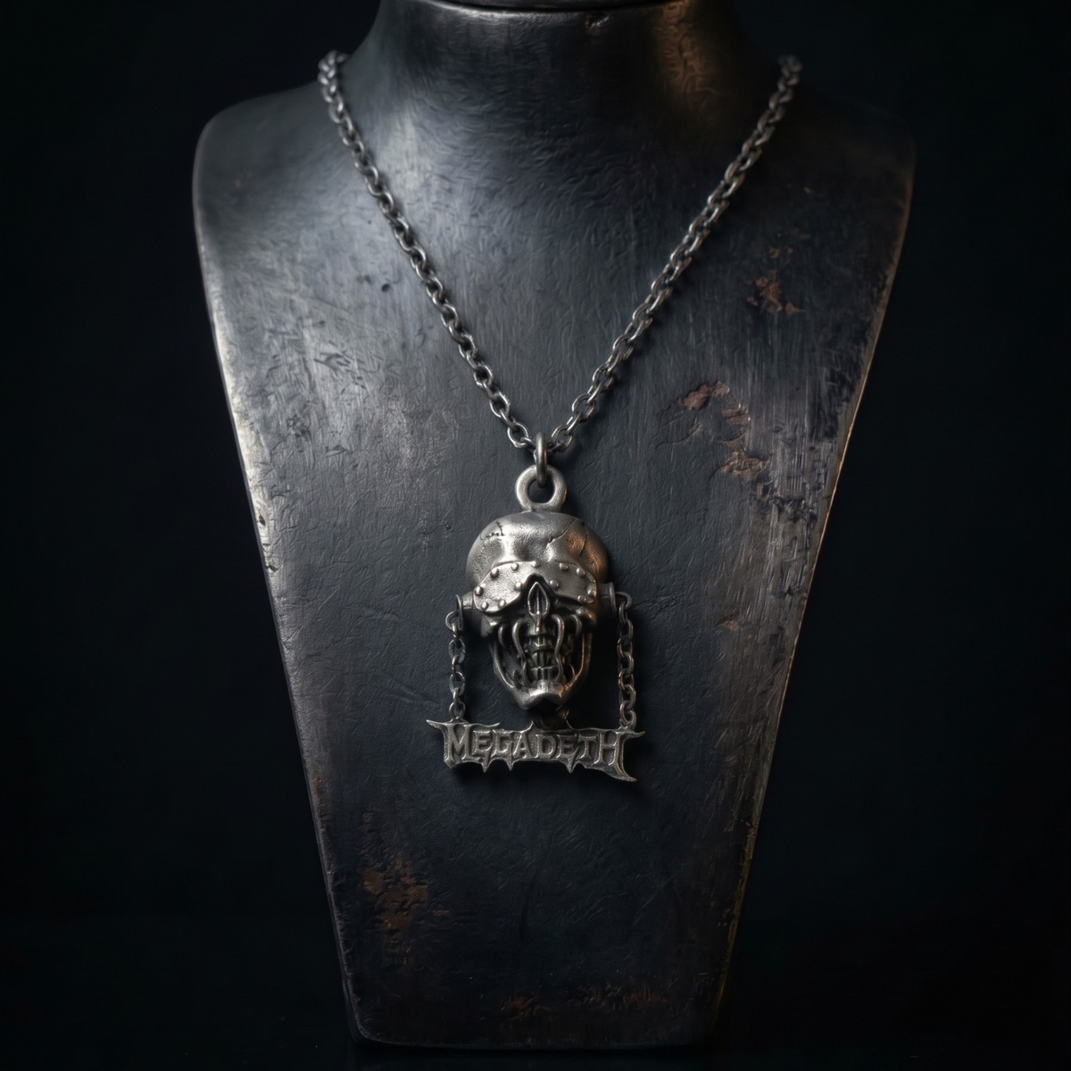 We Rock Megadeth necklace featuring a detailed silver skull pendant with the band logo on a dark chain