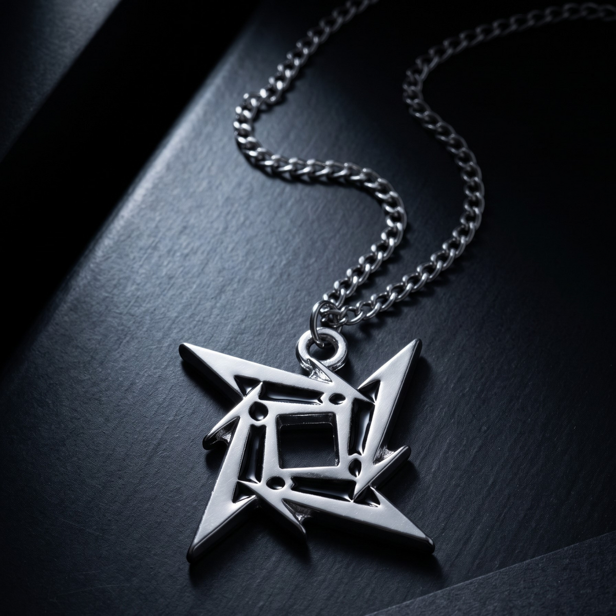 We Rock METALLICA 3 necklace featuring a polished silver-tone metal ninja star logo pendant on a matching chain